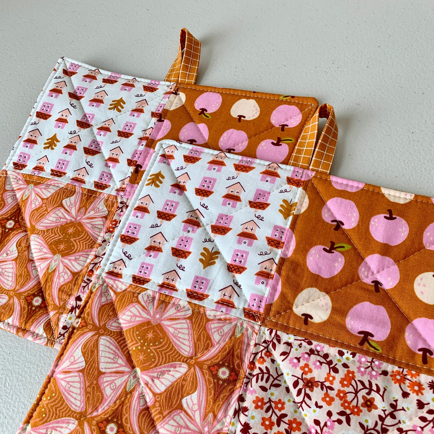 Quilted Pot Holder Set with apples, butterflies, and flowers